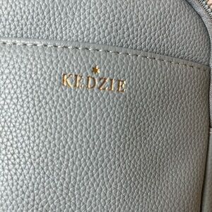 Kedzie Pebbled Light Gray Backpack with Gold Accent